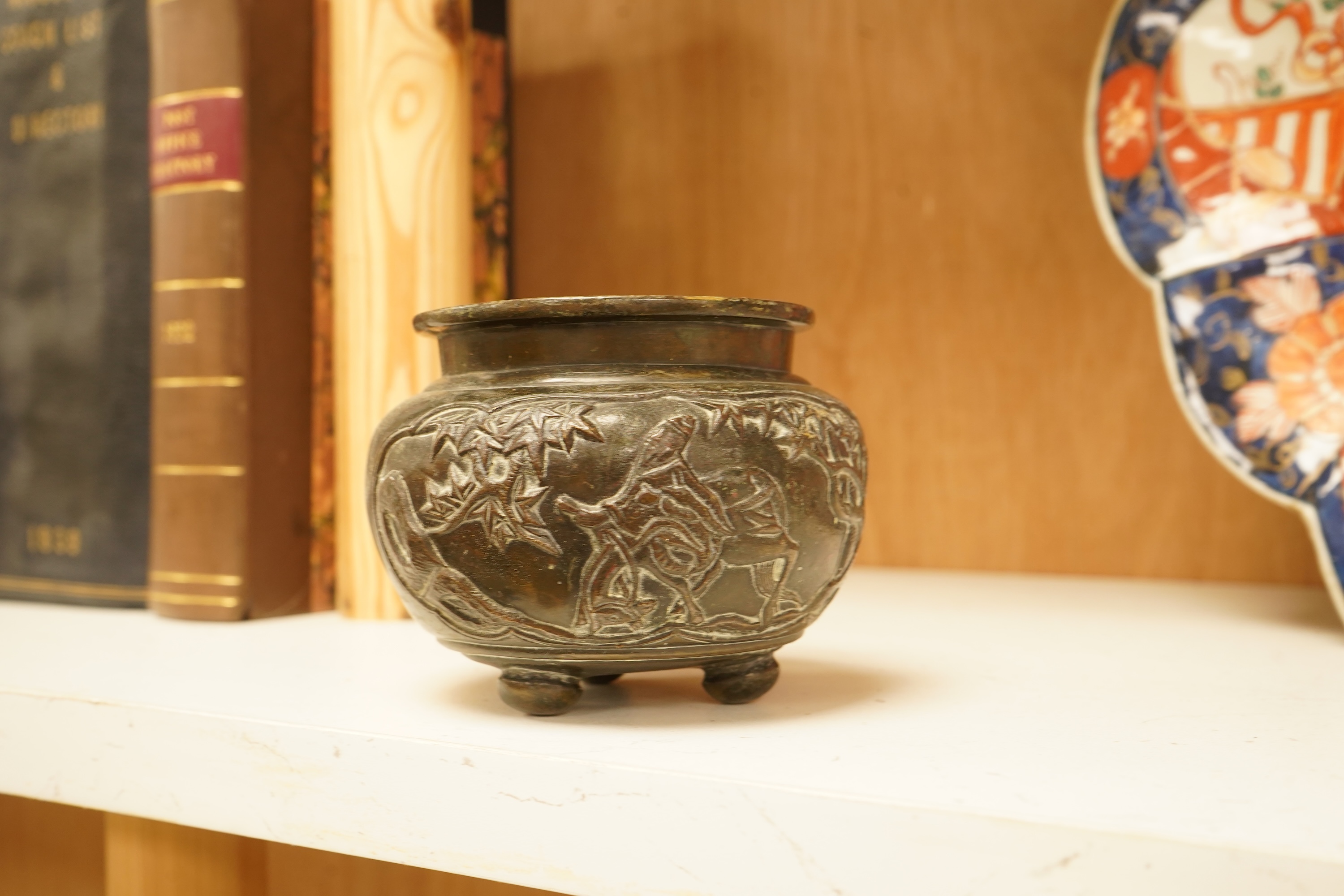 A mixed group of metalware including an Art Nouveau figural dish and pewter dish, a candlestick etc